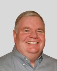 Daniel McGovern in grey collared shirt