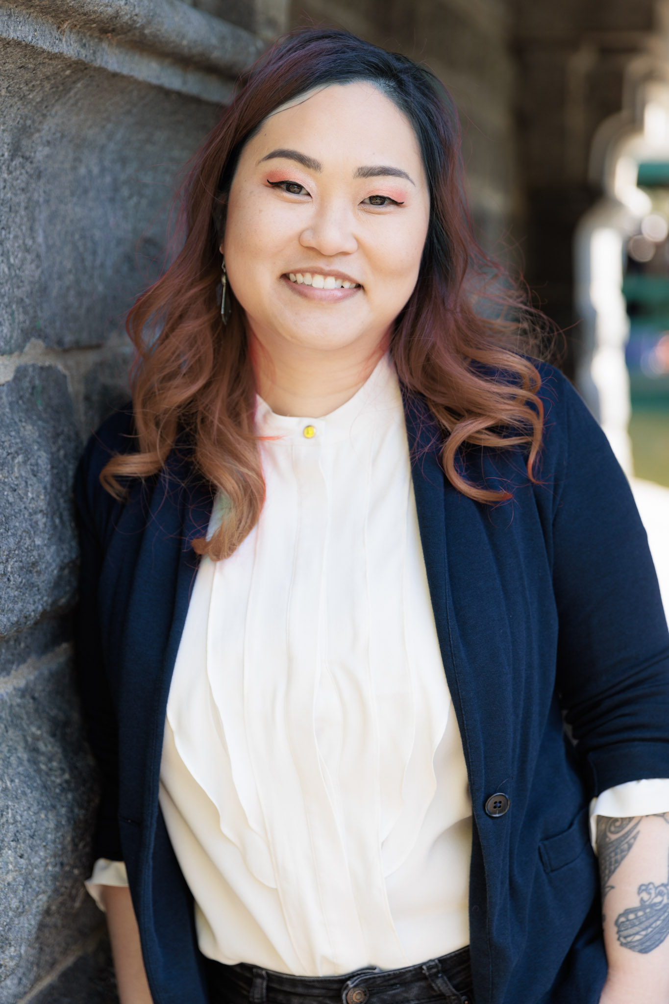 King Yan Kwok  wearing a white button up and a navy blazer