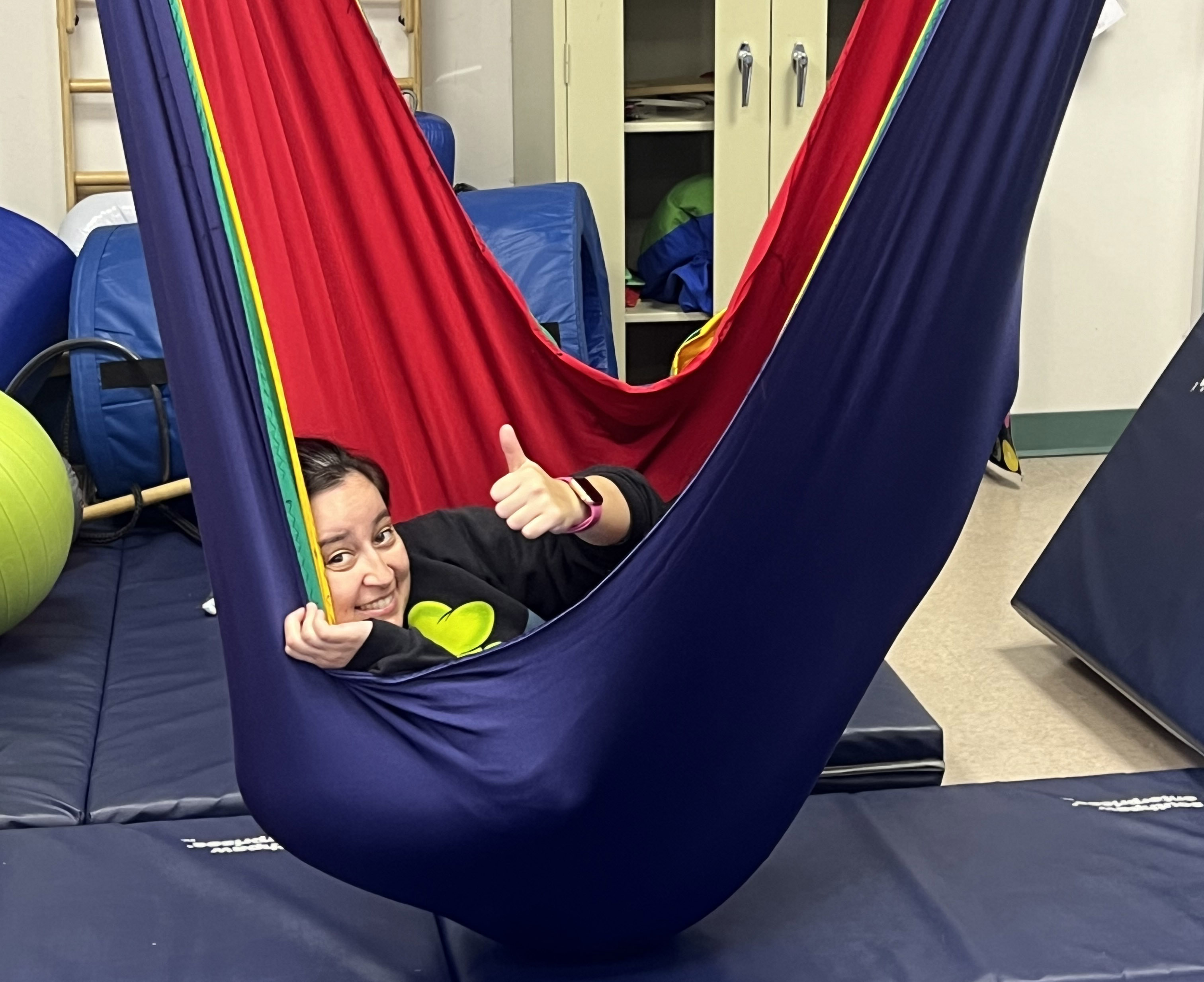 Marianne Linton occupational therapy alumni using equipment