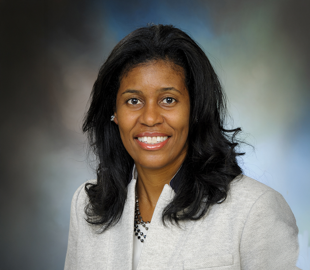 Professional headshot of woman in business attire