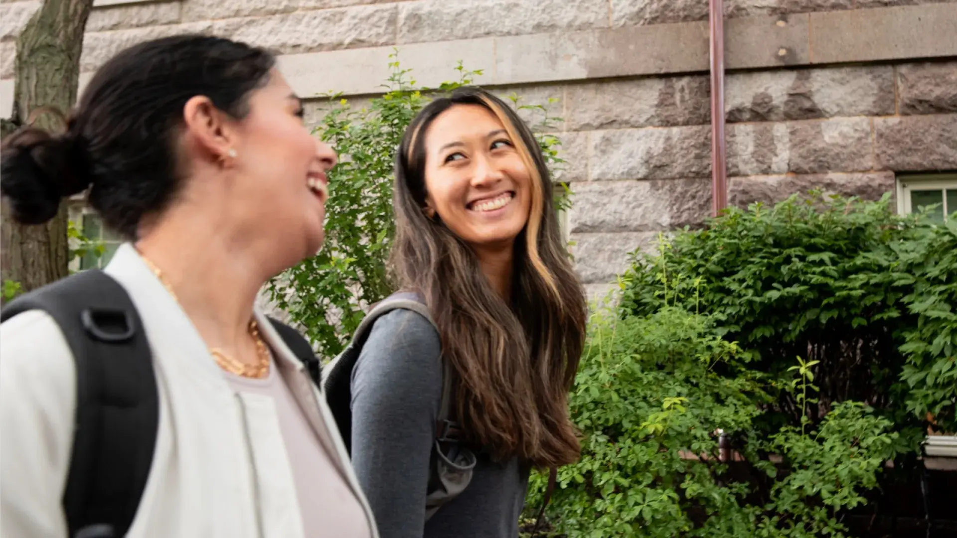 Two female students walking to class