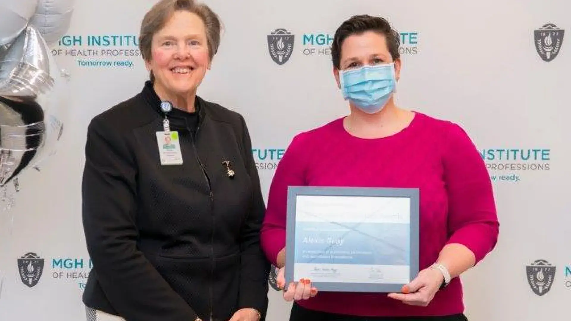 Alexis Guay stands with her award