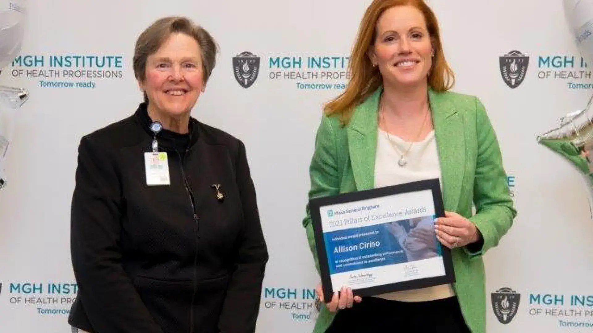 Allison Cirino stands with her award