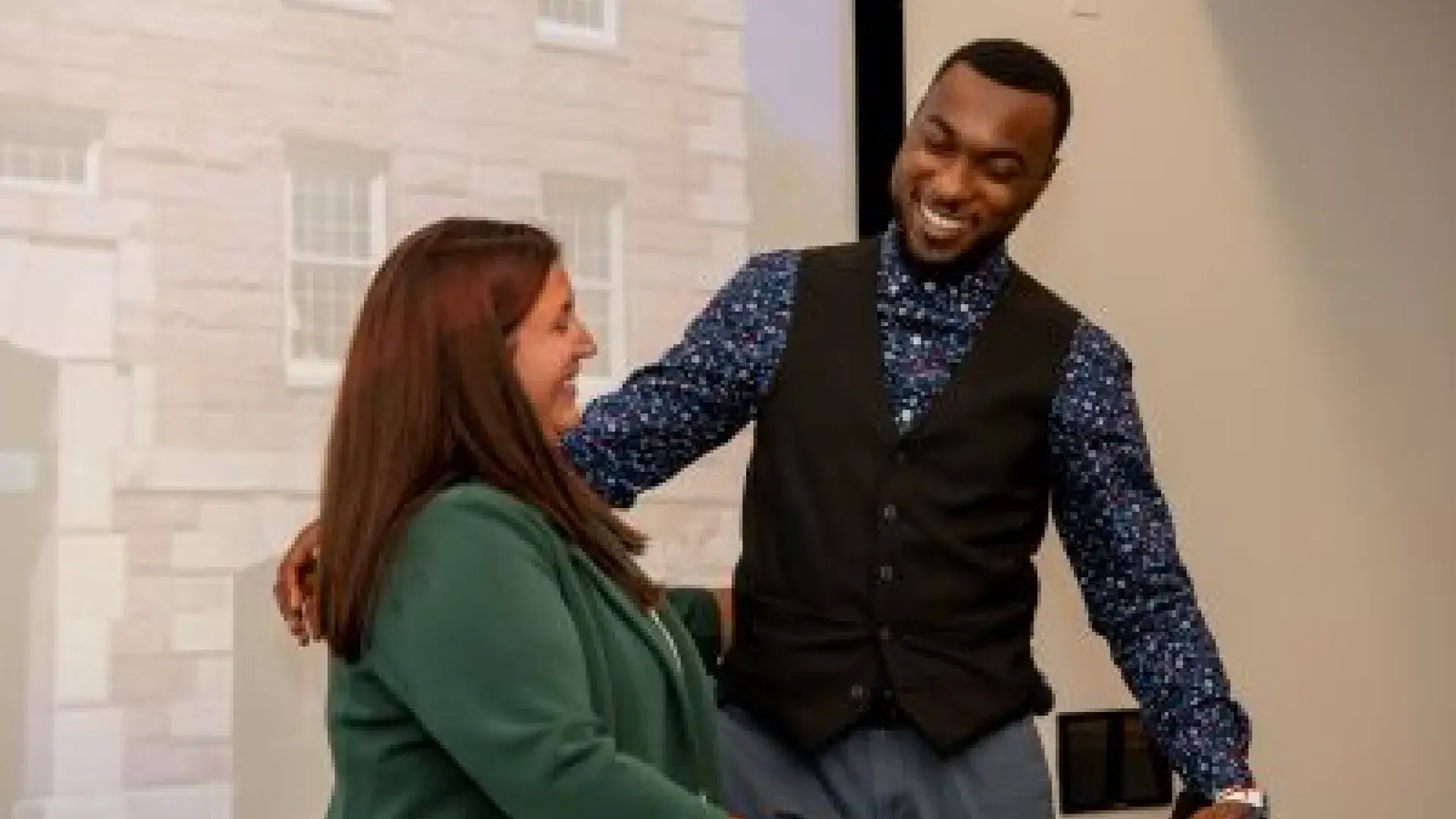 Dr. Rebecca Hill greets Ian Syblis as she presents him  with the "Wetherill Award."