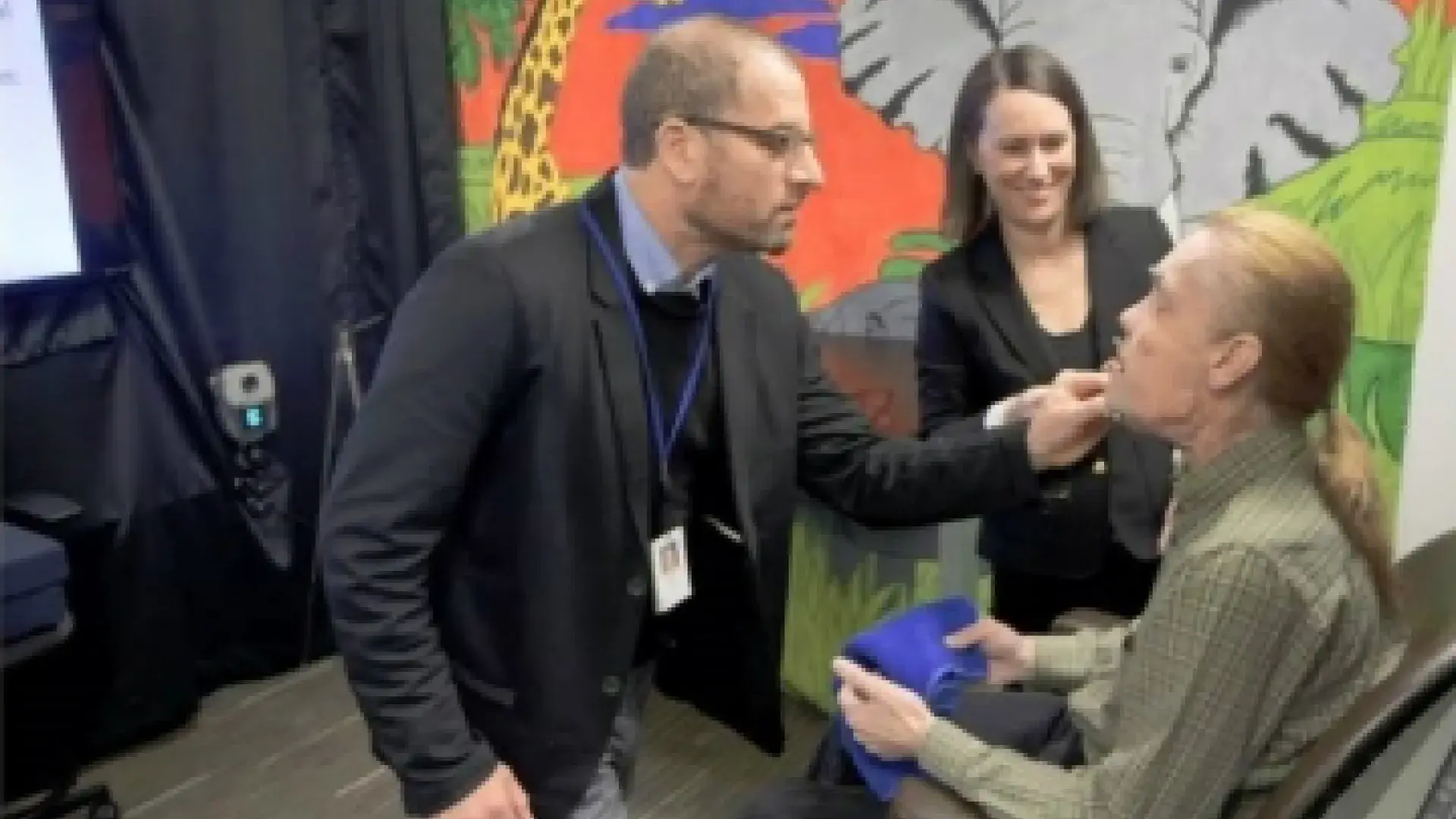 Dr. Jordan Green and Dr. Bridget Perry '18 work with a facial transplant patient in the Speech and Feeding Disorders Lab.