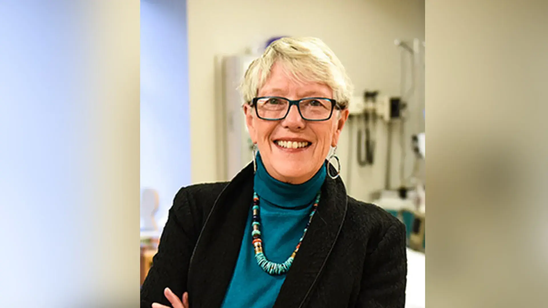 photo of linda she has blonde hair and wears glasses