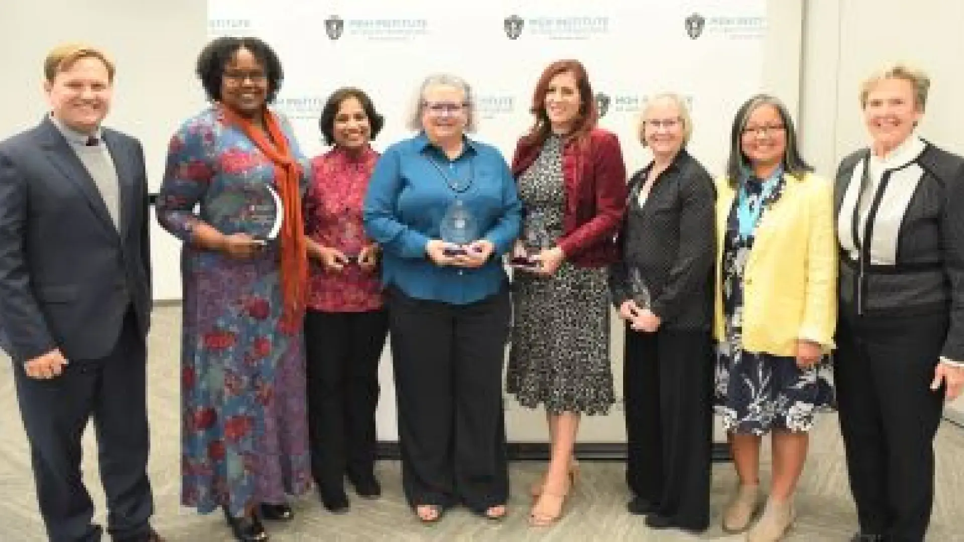 Provost Reamer Bushardt (far left) and President Paula Milone-Nuzzo (far right) flank awardees Eleonor Pusey-Reid, Keshrie Naidoo, Karen Chenausky, Prue Plummer, Patricia Reidy, and Gayun Chan-Smutko.