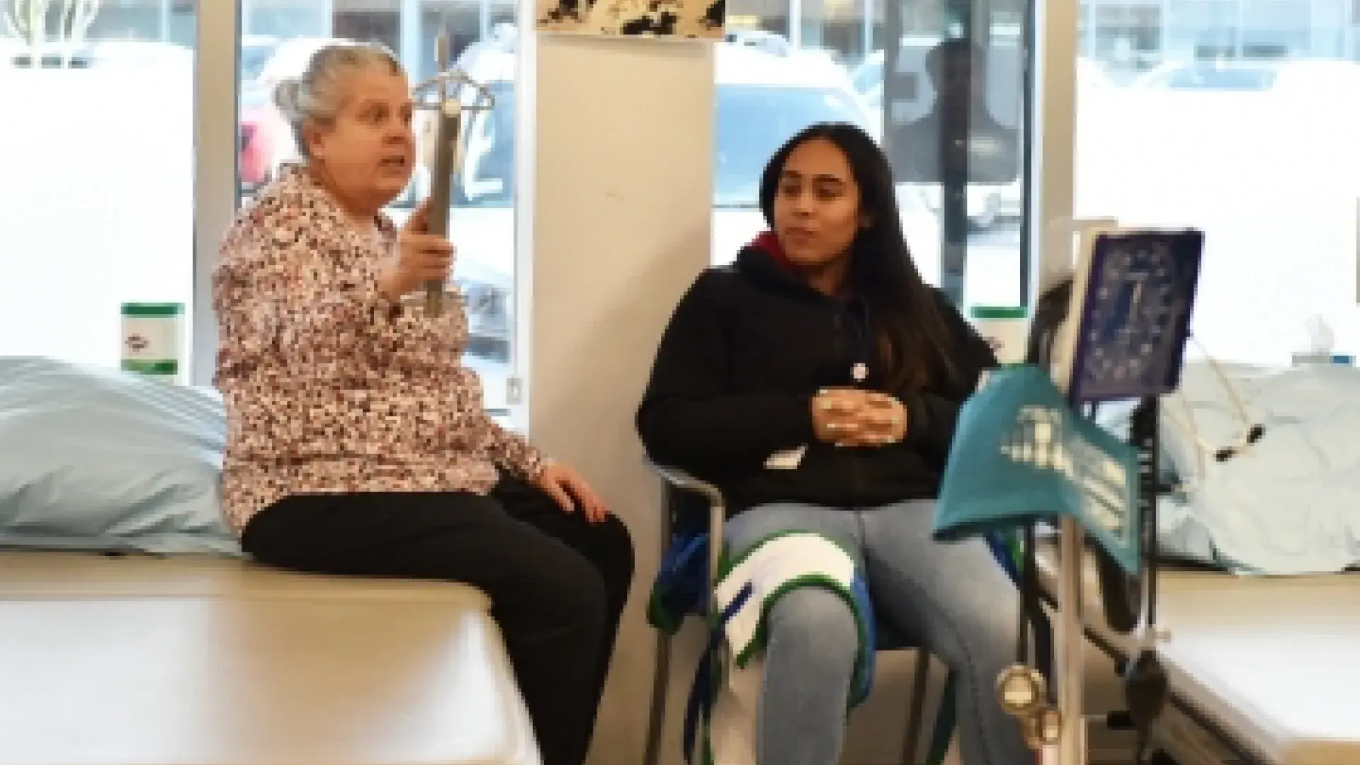 Jane Baldwin demonstrates PT equipment for the MGH Youth Scholars.