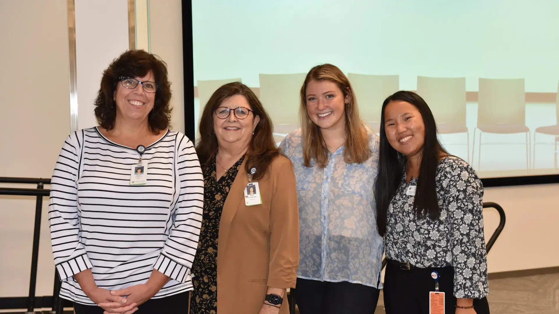 Pauline Fiorello, Certified Brain Injury Specialist and OT Instructor, Dr. Mary Hildebrand, Associate OT Professor and Founding Director of the OT CLiPR, and OT doctoral students Jillian Yamartino and Alexandra Podell stand together after Grand Rounds.