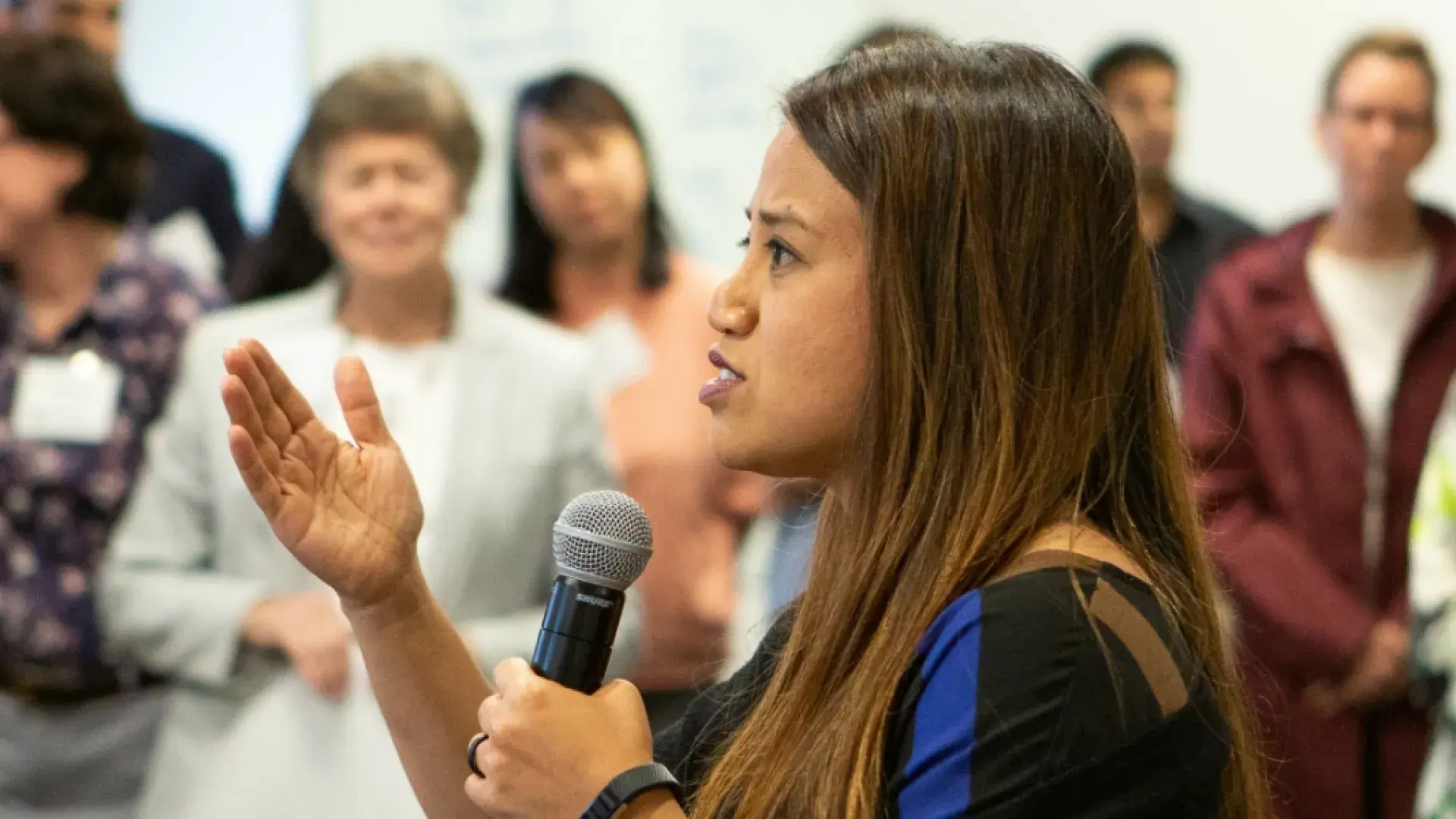 woman speaks in a microphone