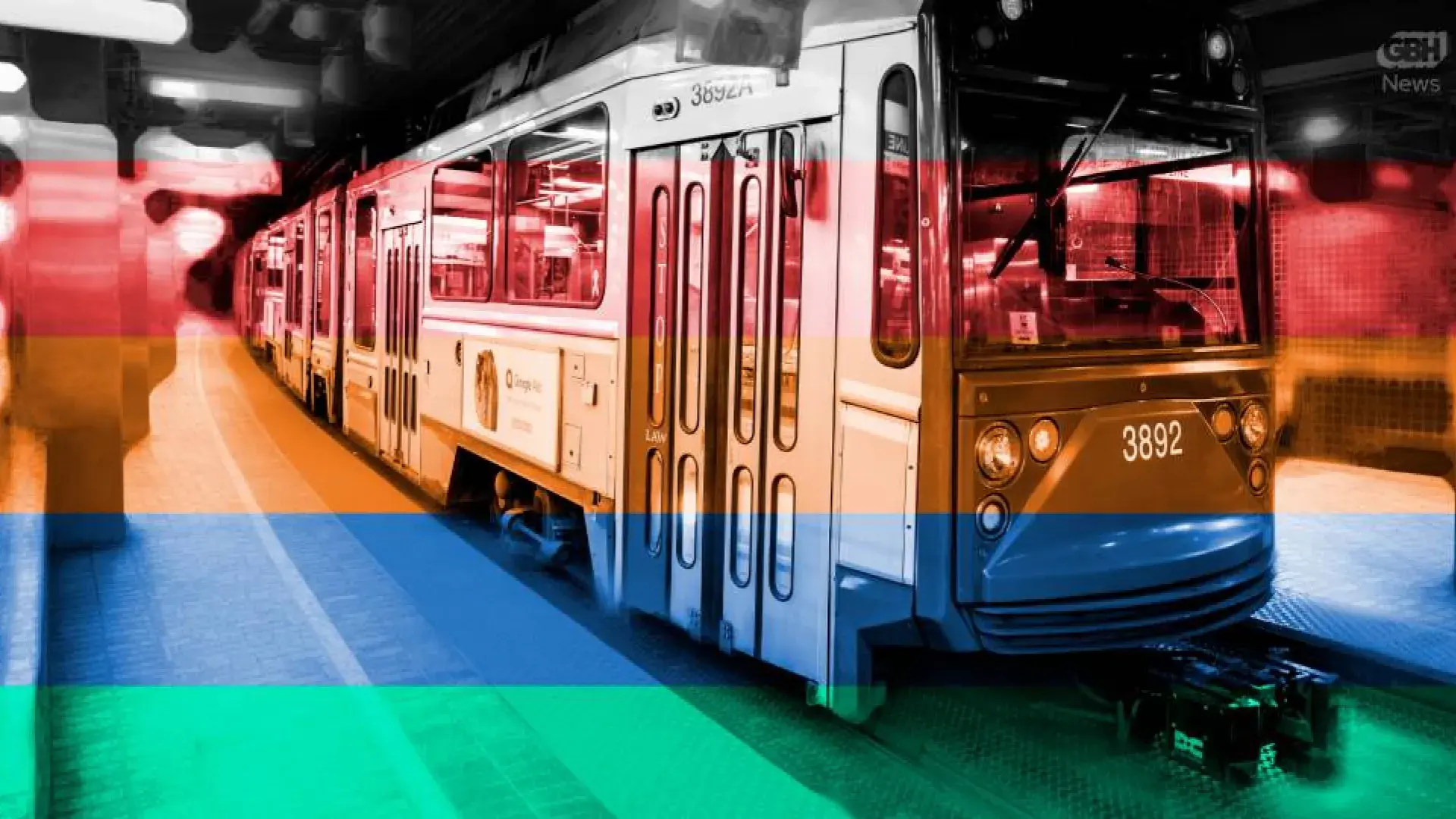 train with red, orange, blue and green stripes running across the photo