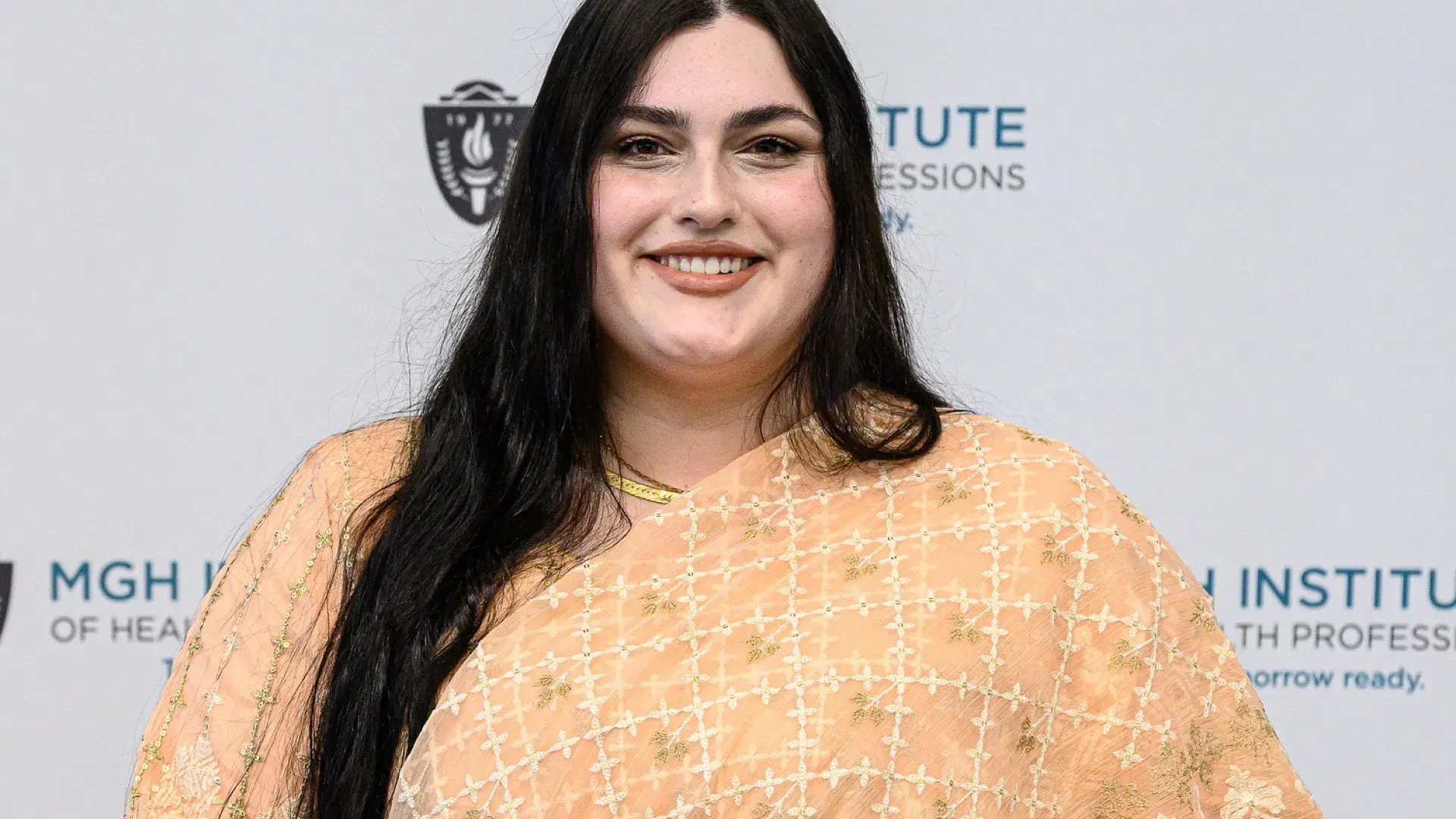 Brianna holds her award