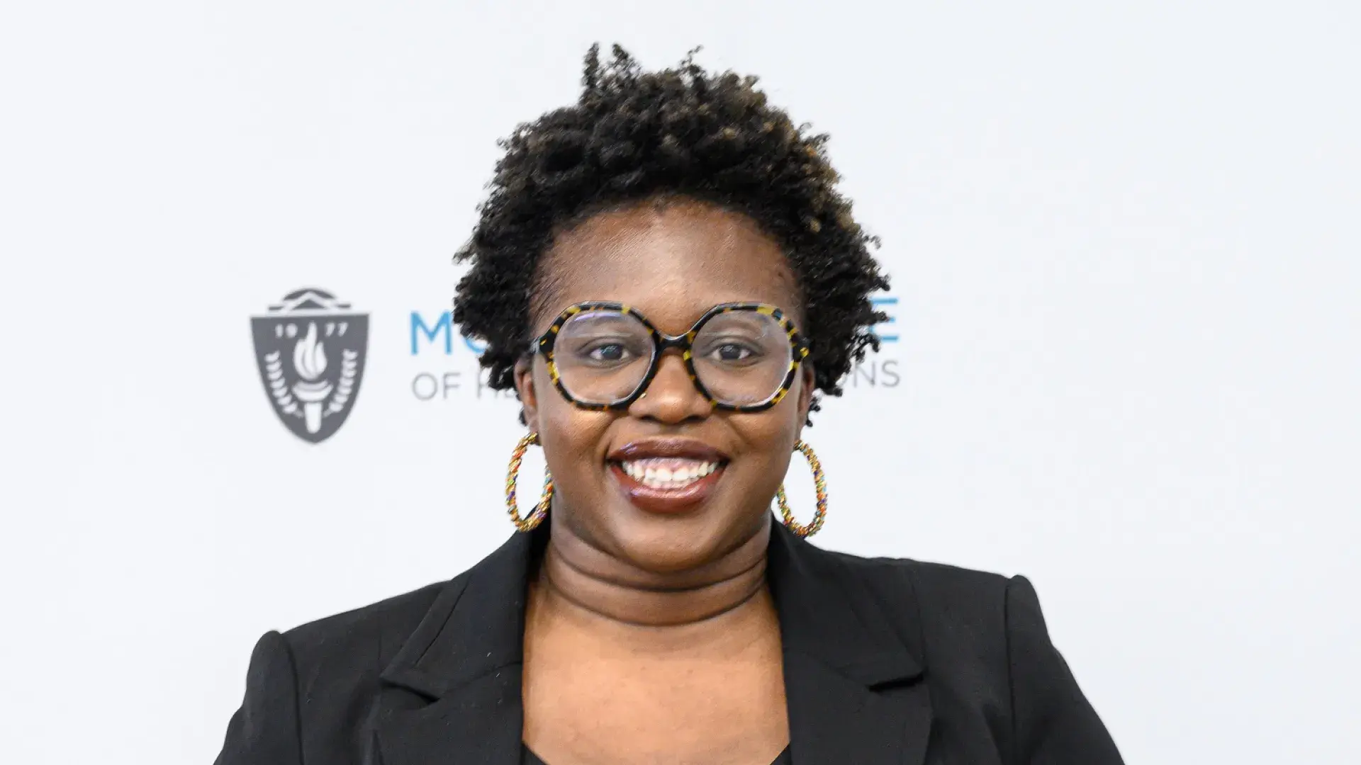 kanisha holds her plaque