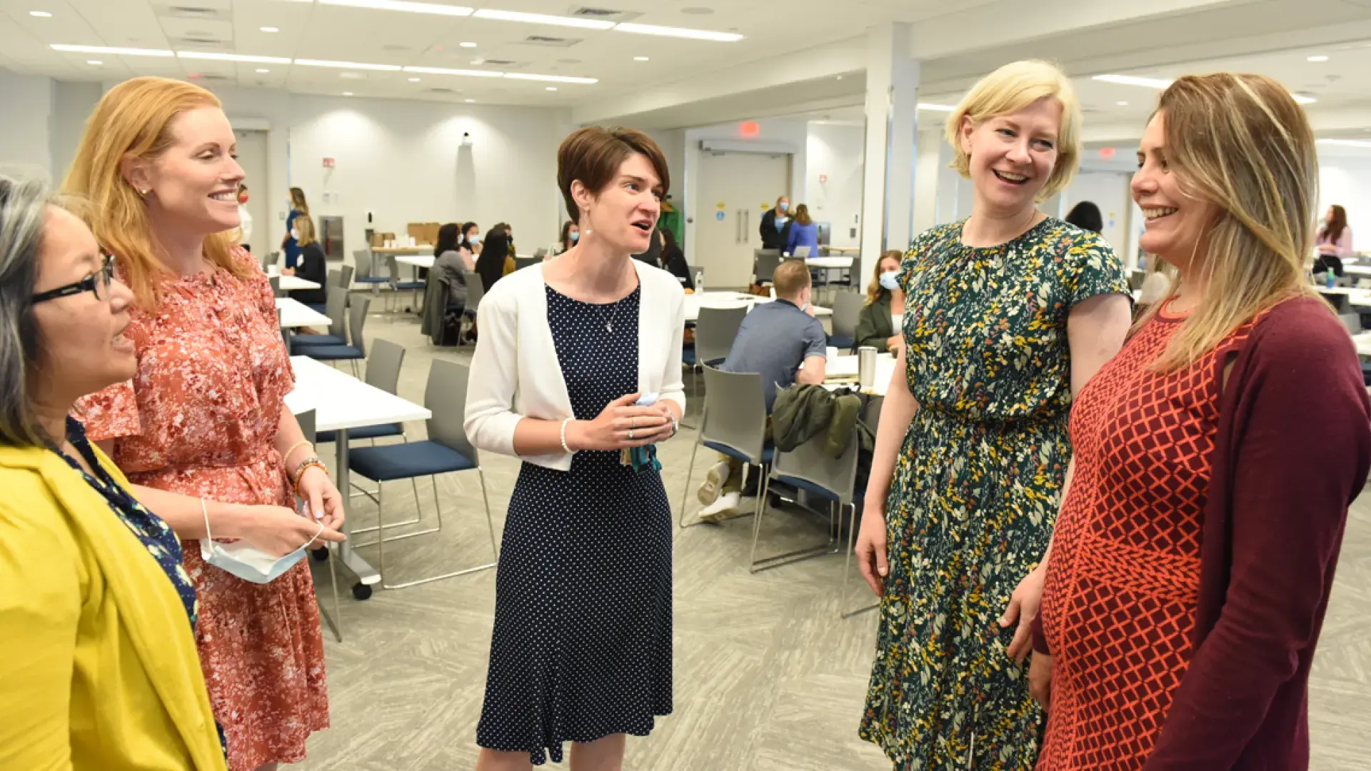 L-R: Genetic Counseling faculty Gayun Chan-Smutko, Allison Cirino, and Ann Seman, Chair Maureen Flynn, and Program Manager Sanae Maouhoub talk during a break.