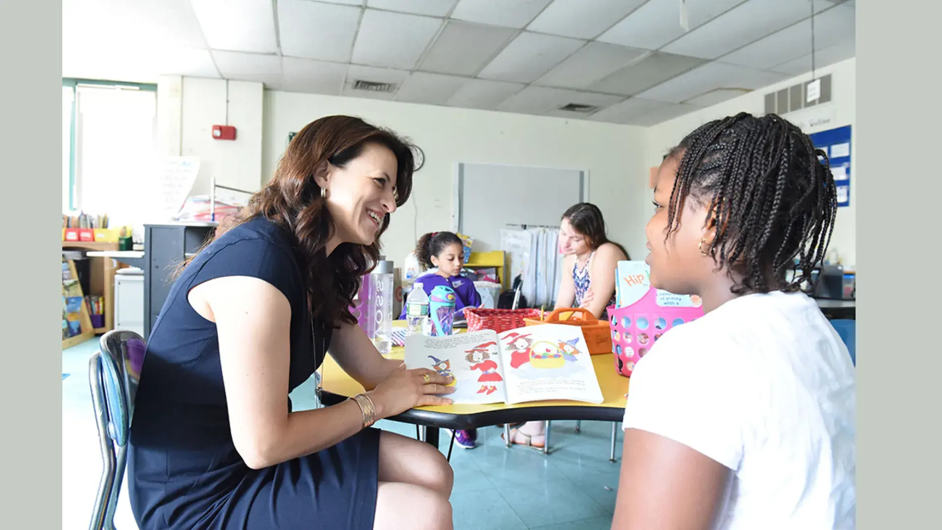 Photo of Dr. Joanna Christodoulou with child at the Harvard Kent School