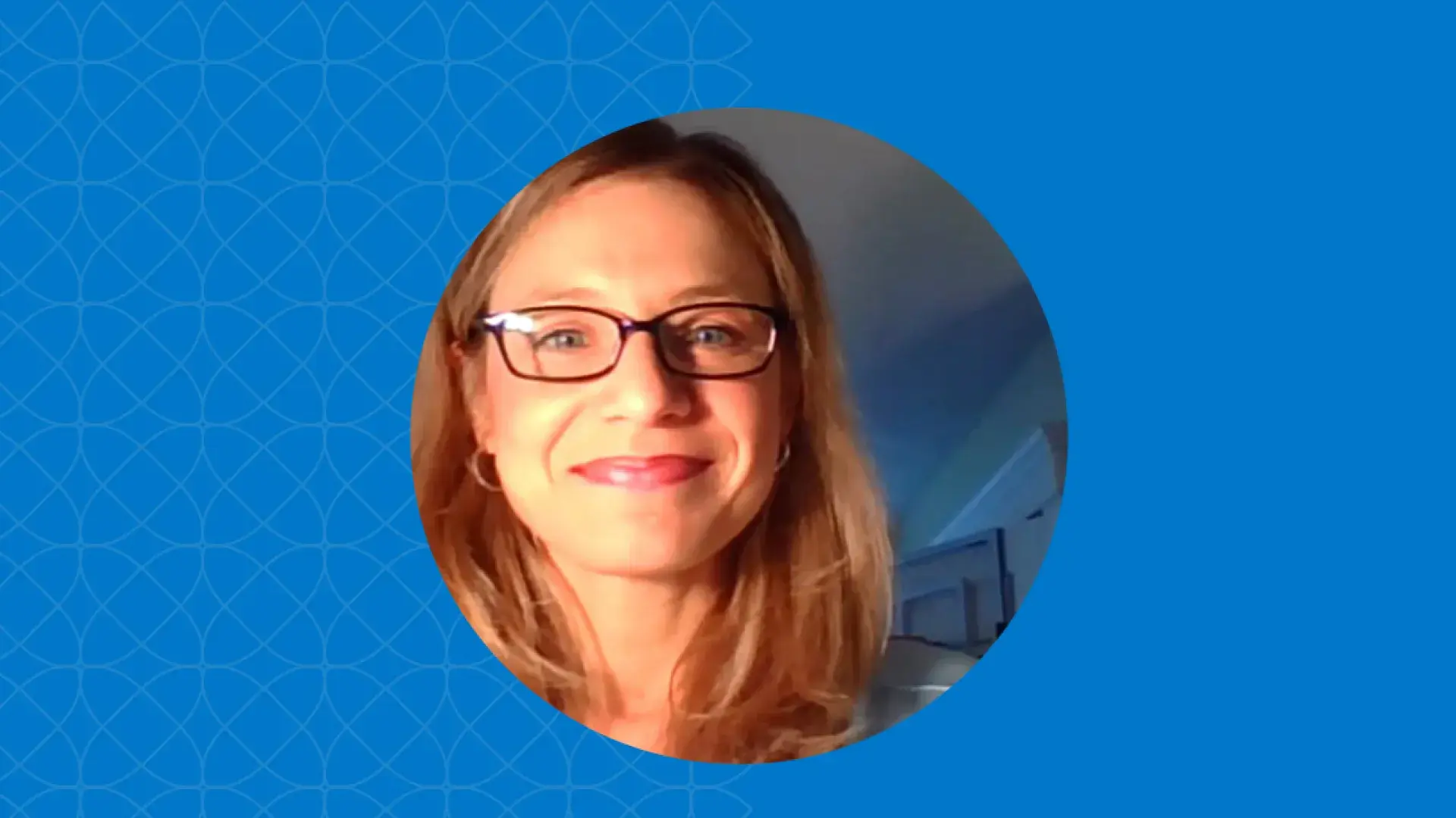 woman's face in the glow of a laptop