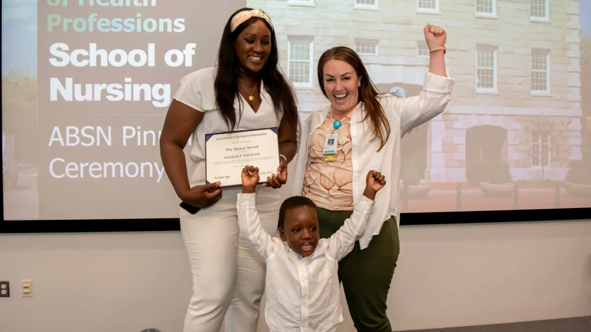 Khadijah Fofanah was honored with the “Quinn Award.” She's pictured celebrating with her son and Dr. Lisa Quinn (right).