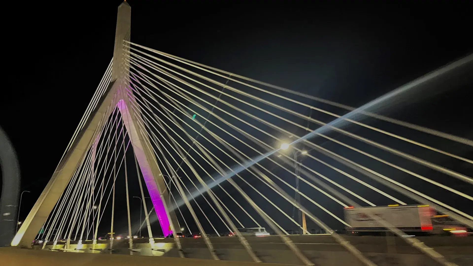 suspension bridge with purple uplighting