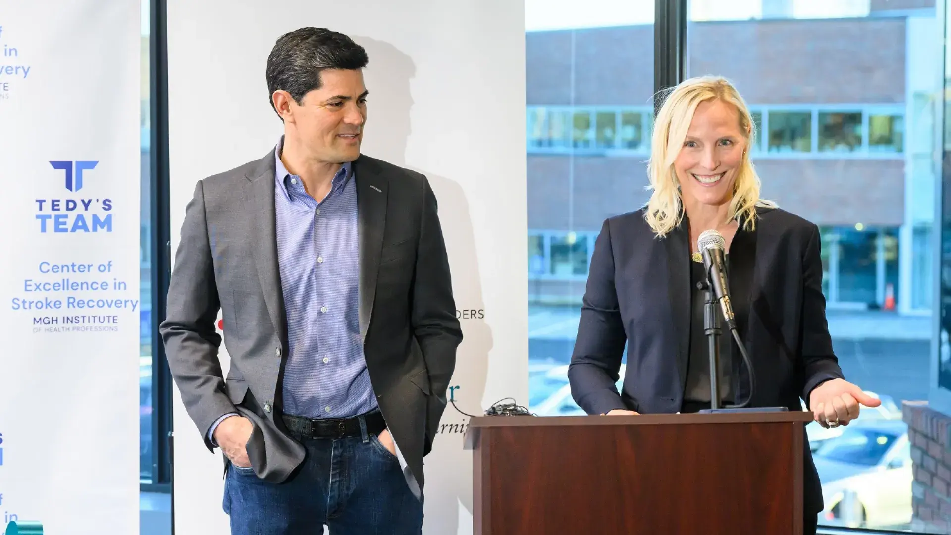 heidi smiles at podium