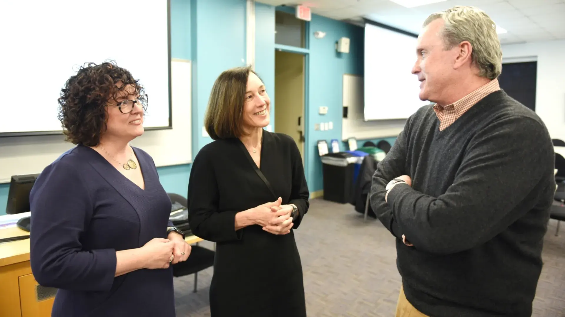 the three talk together in a classroom