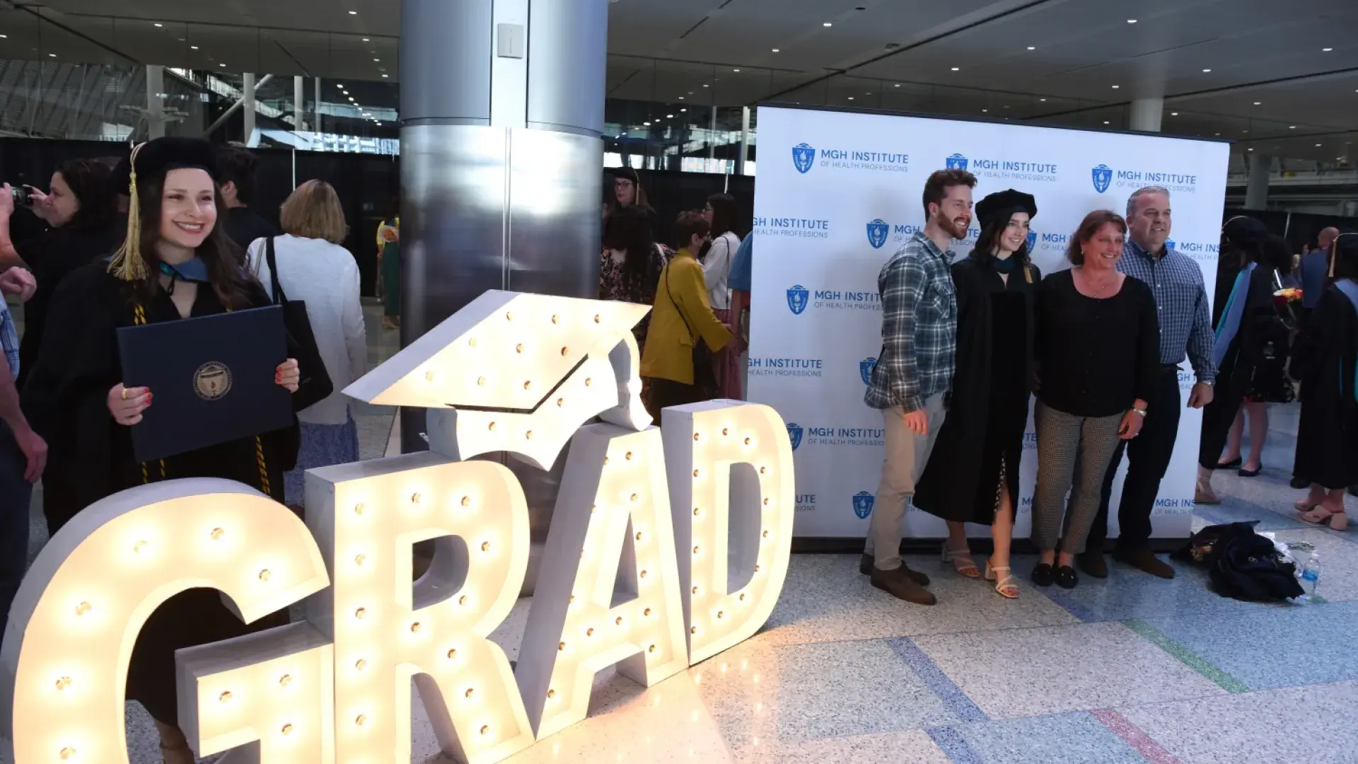 New graduates pose for photo after the morning ceremony.