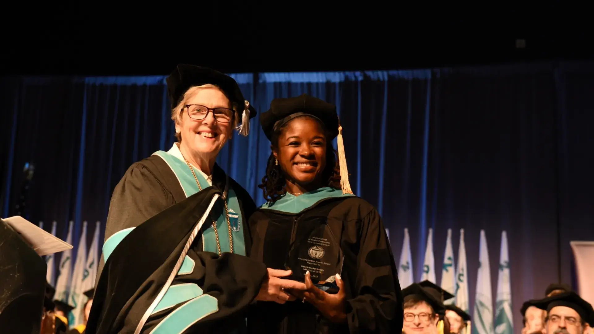 paula and woman smile together