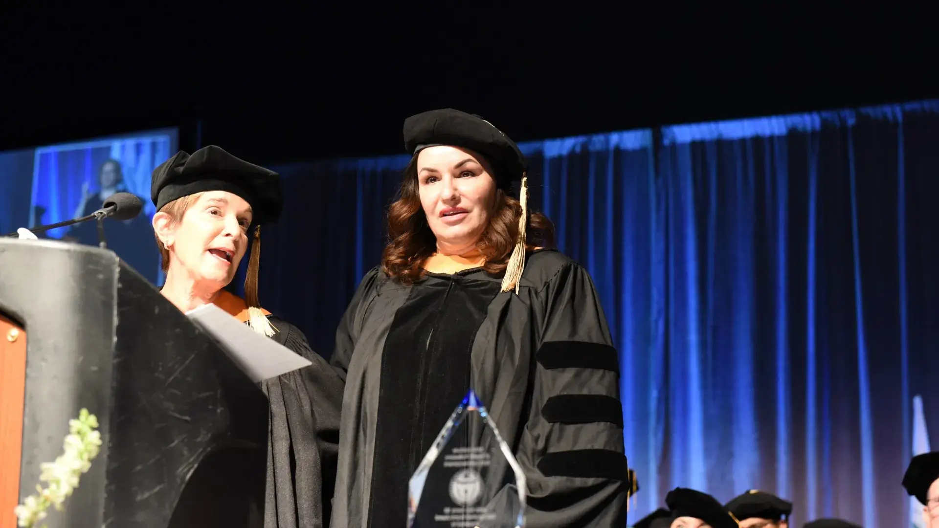 angela receives a glass award