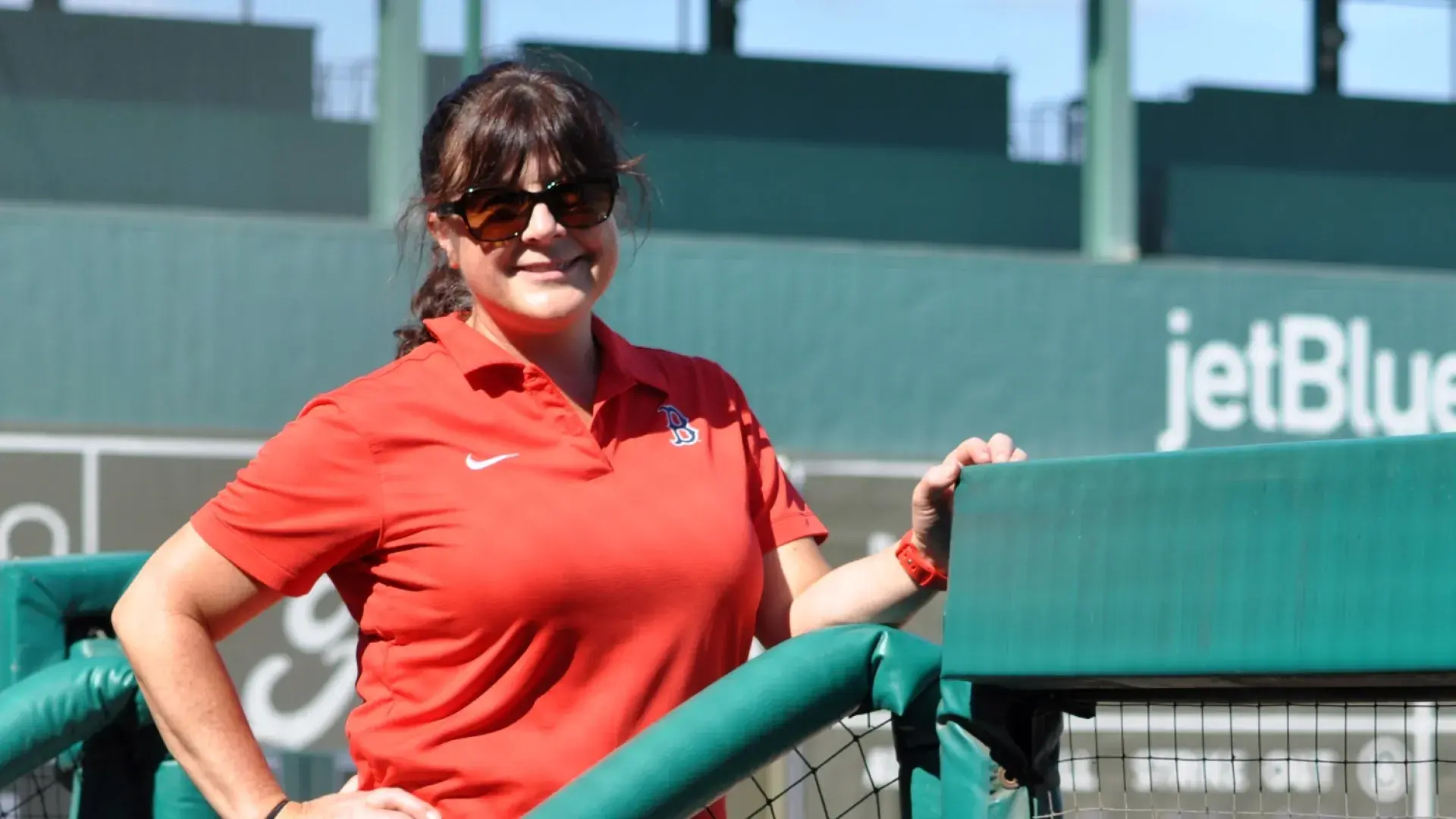 Woman standing in baseball field