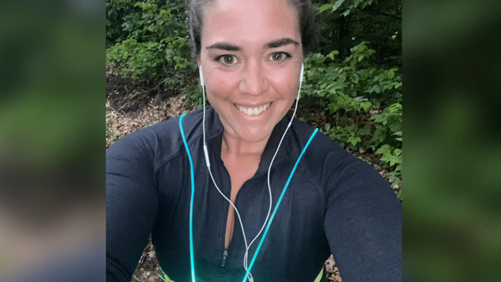 jessica wears headphones and a reflective belt