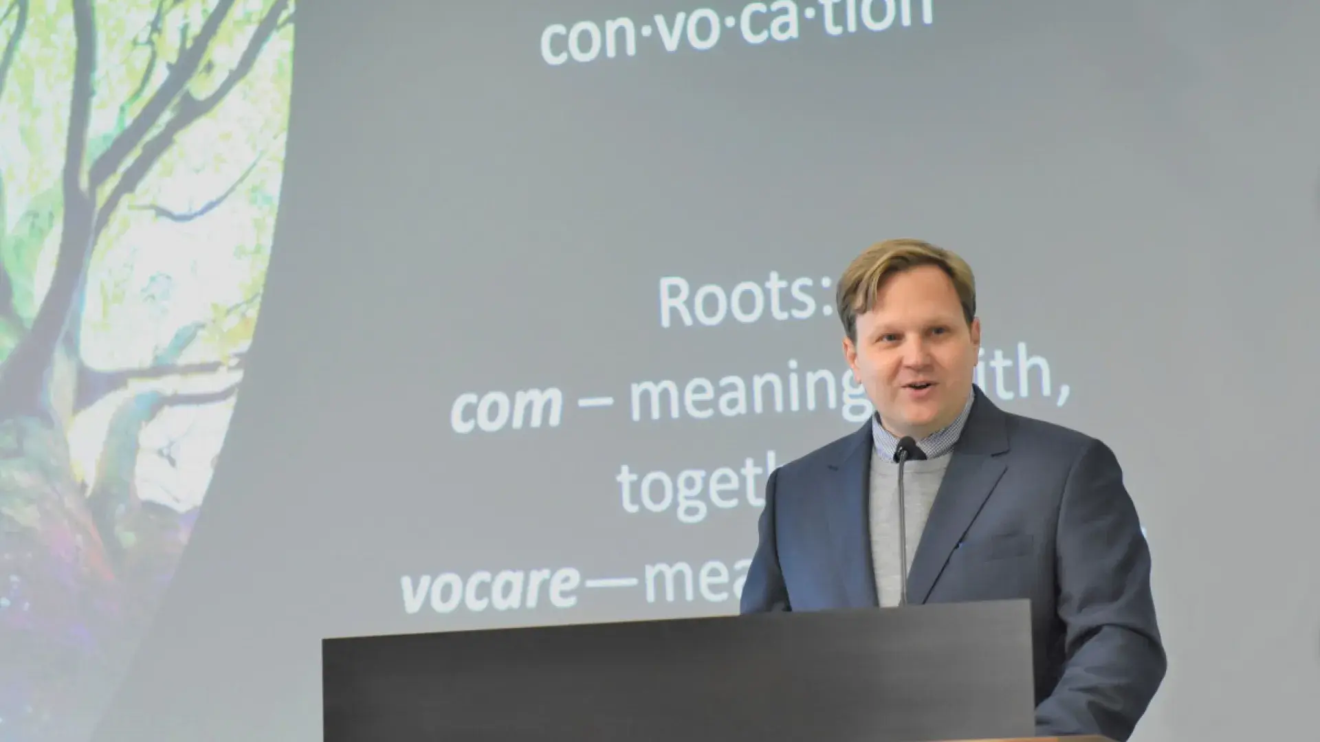 Man speaks at podium