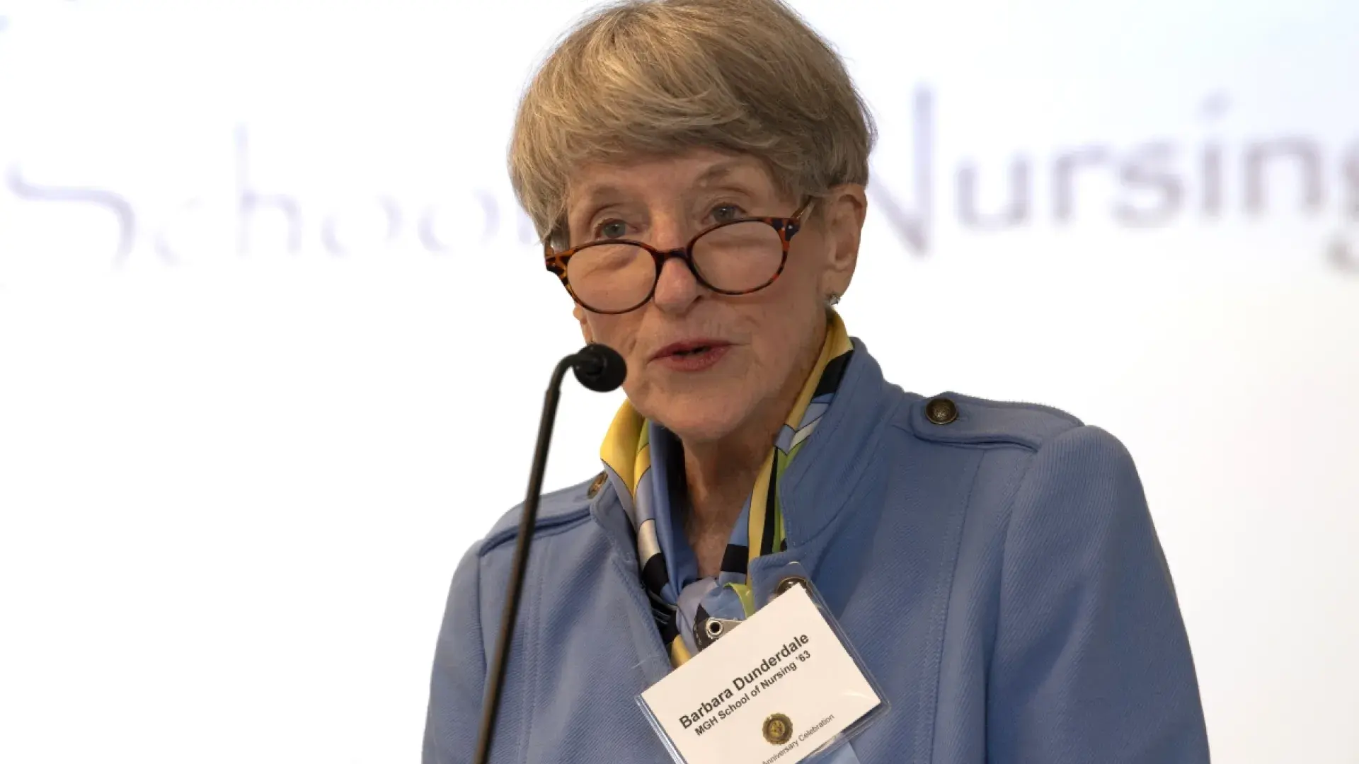 Woman talking at podium