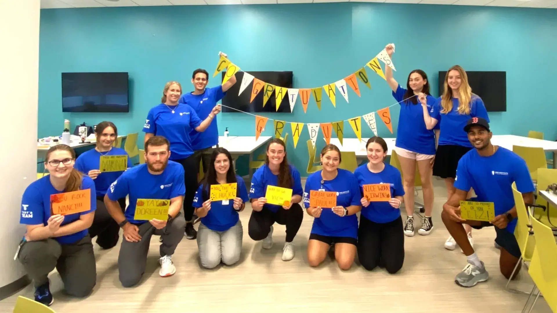 Students holding signs and a banner.