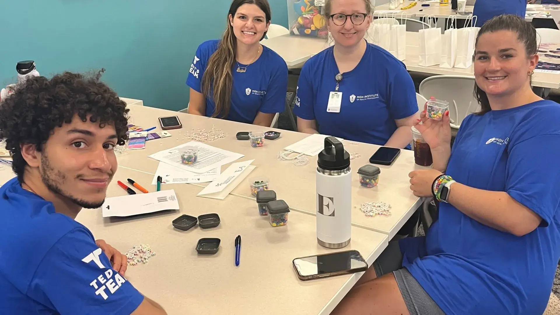 43 people sitting around a table