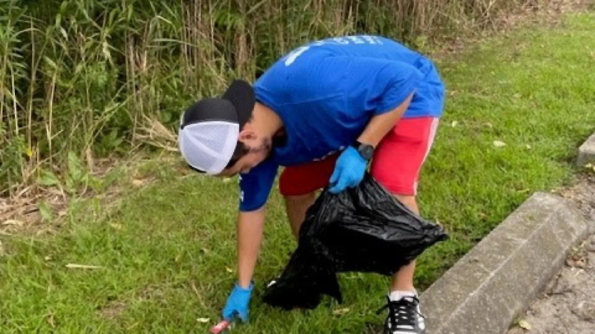 Person picking up trash