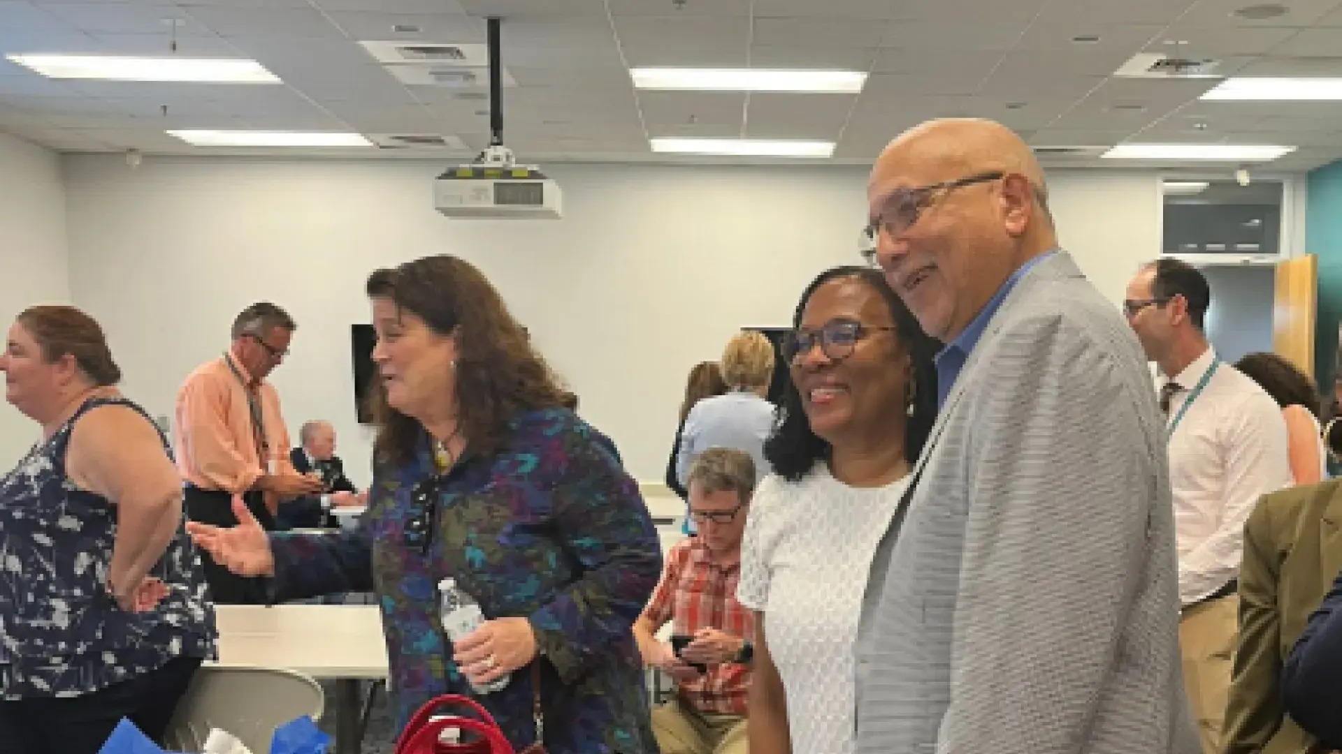 man and woman pose for photo