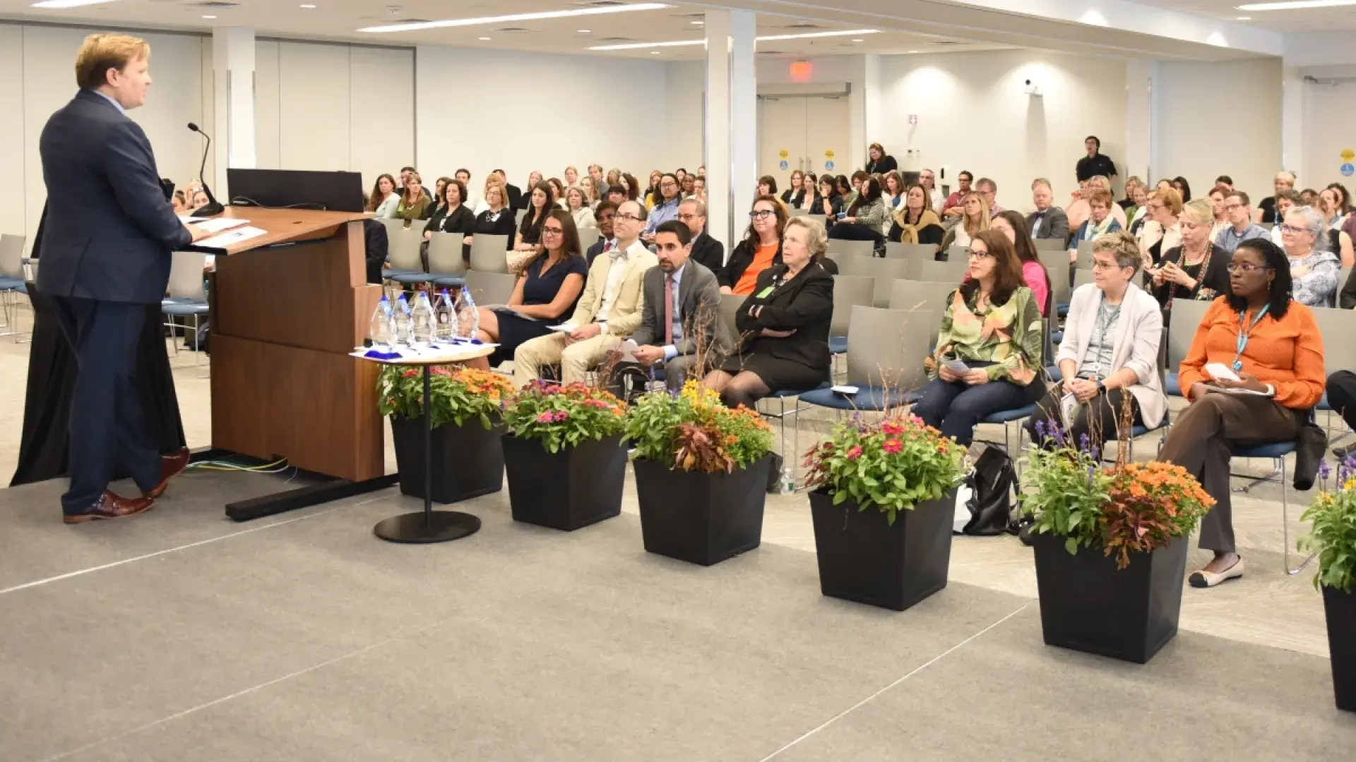 Man speaking to a room with people