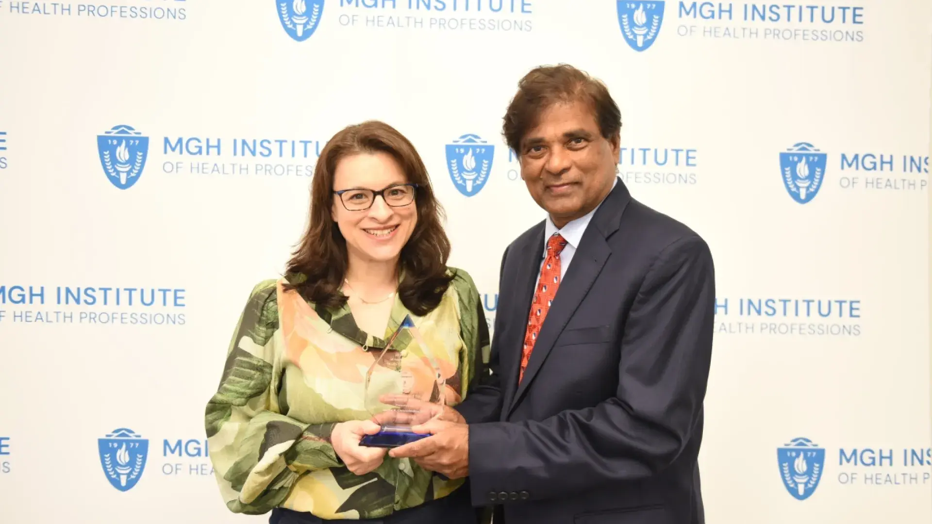 Woman and man smiling at camera