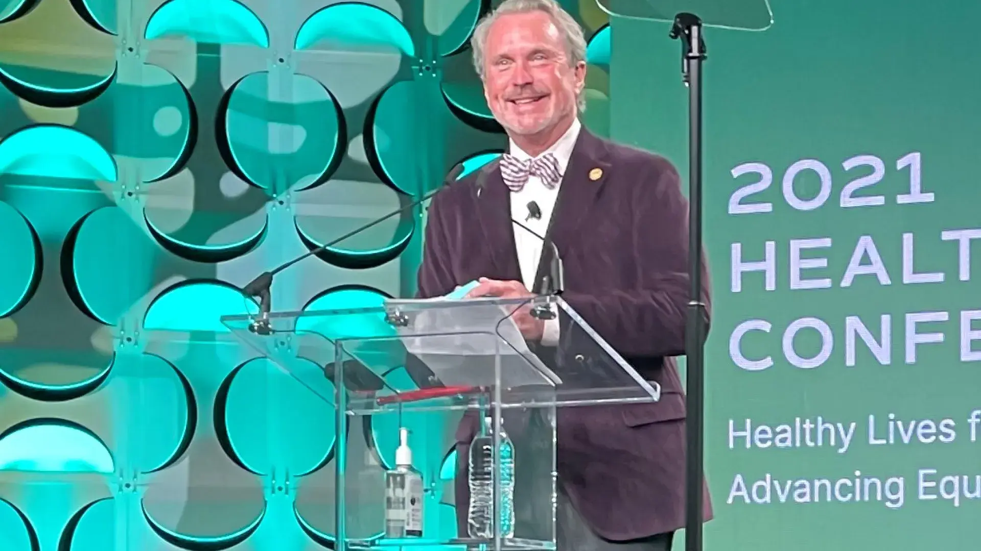 Man stands at podium