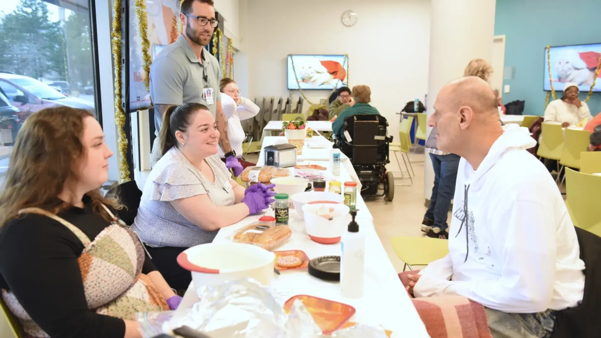 4 people sitting and talking