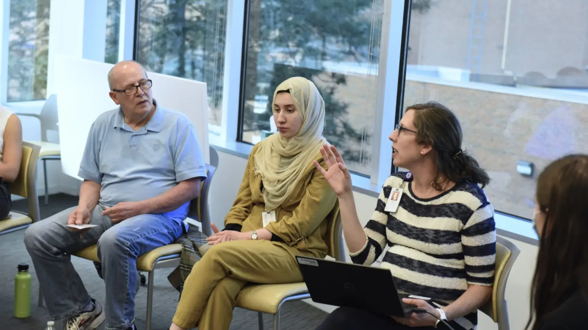 3 people sitting and talking