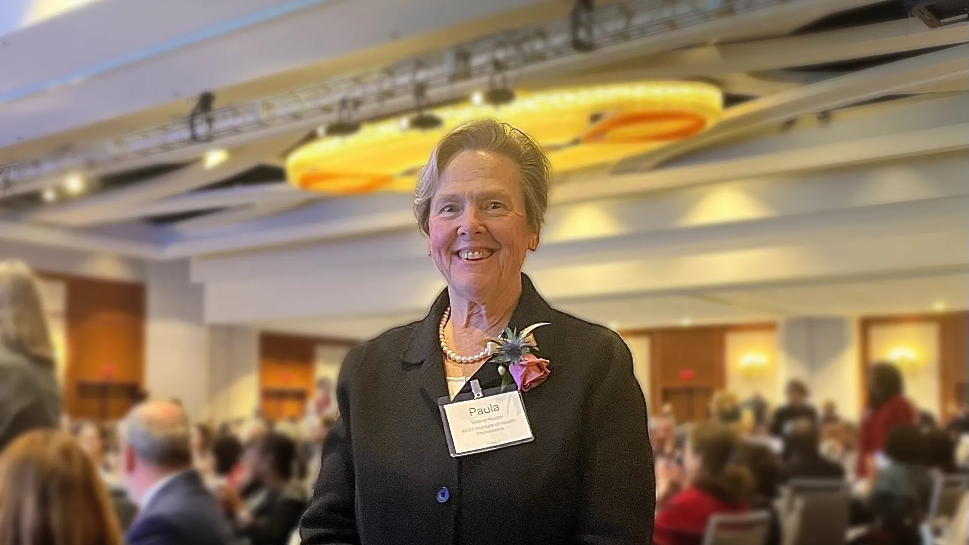 woman smiles and poses