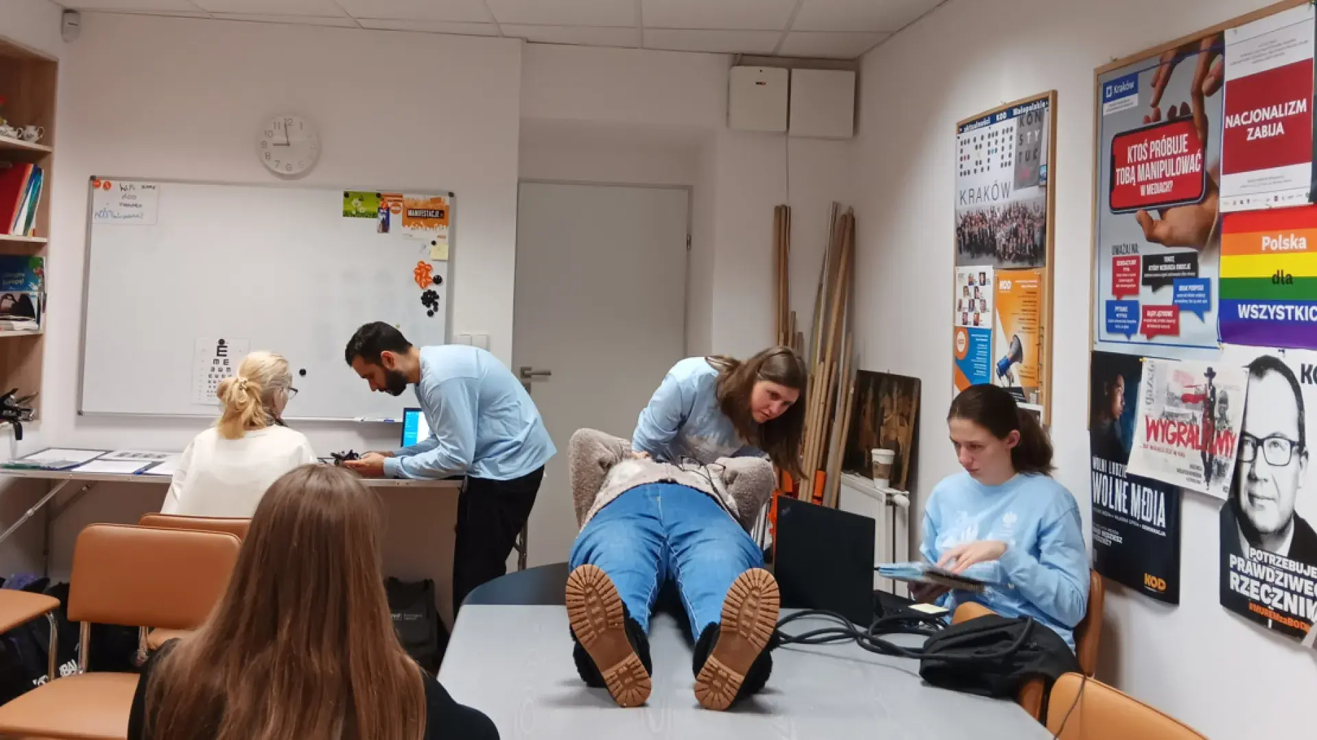 individuals work with patients offering audology services