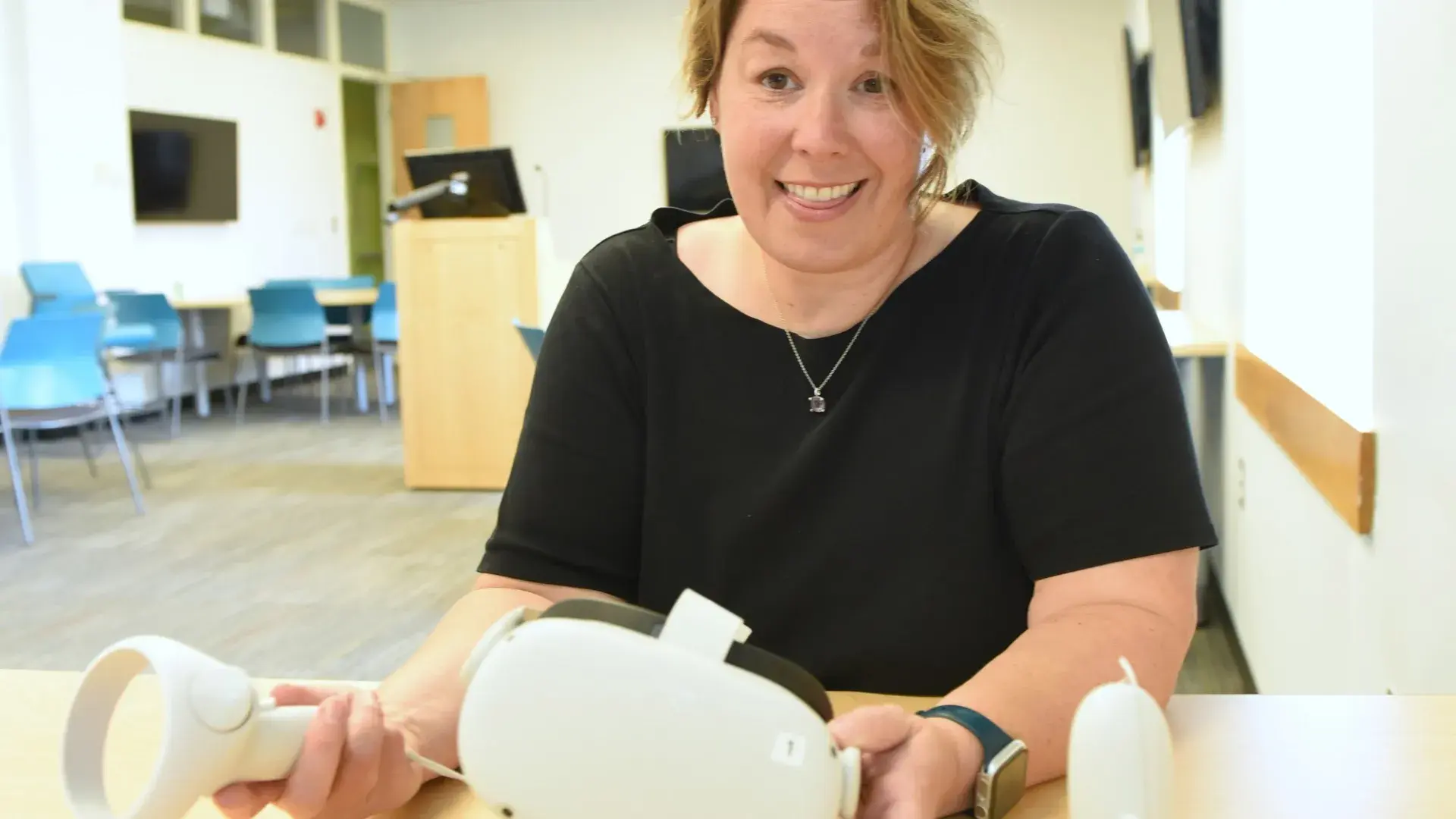 Woman holding a virtual reality headset