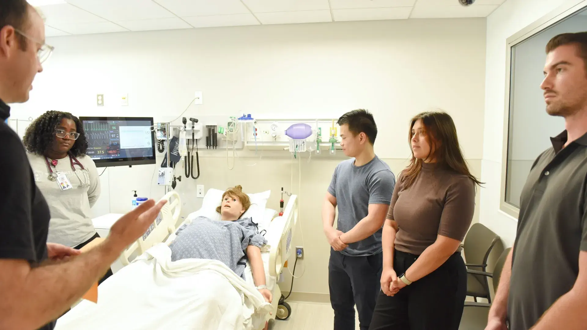 Students talking with faculty member