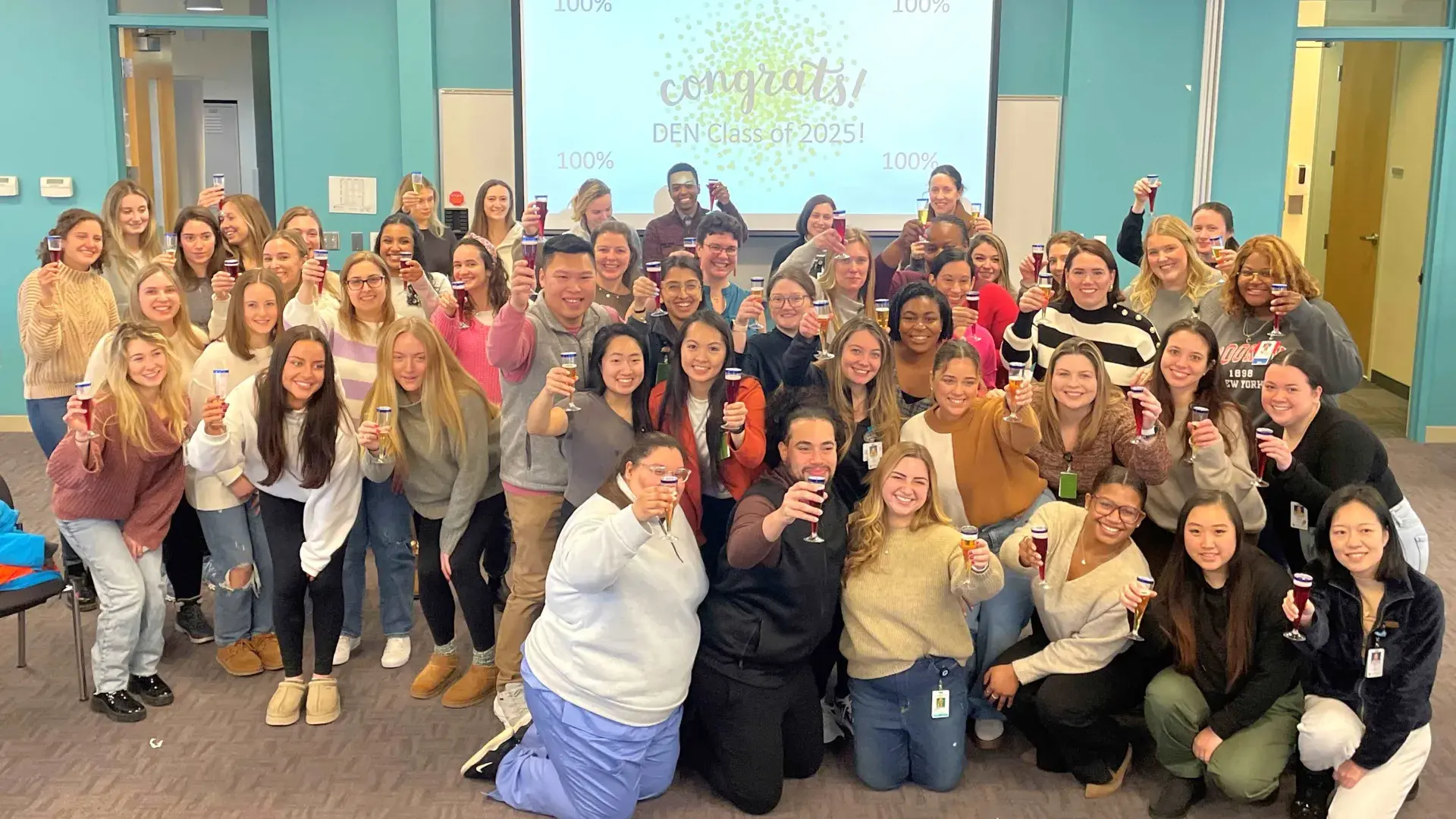 Nursing students raise toast for passing test