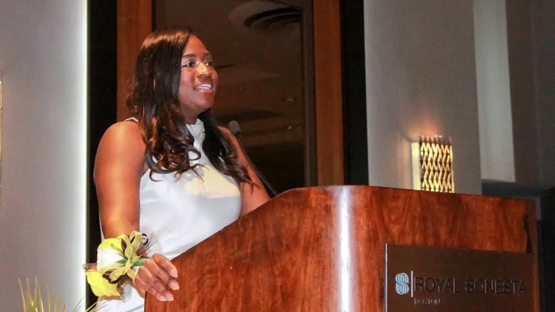 Woman speaking at a podium