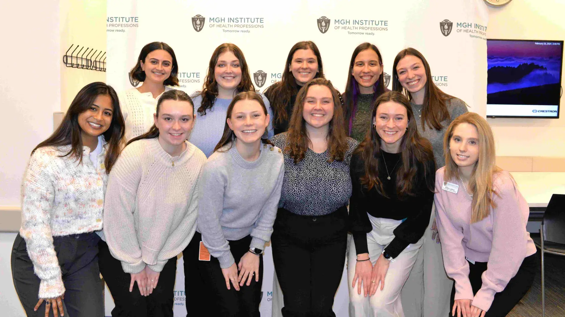 11 students in group smiling