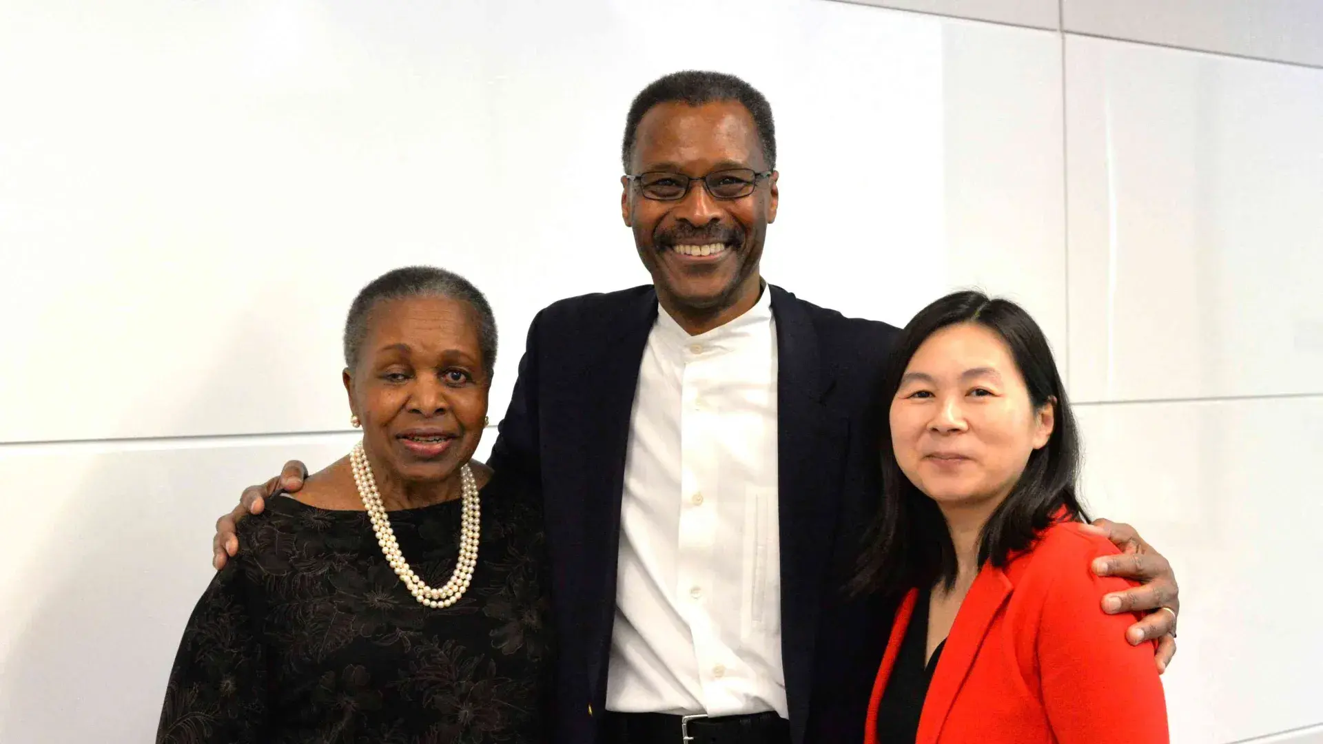 Three people together smiling