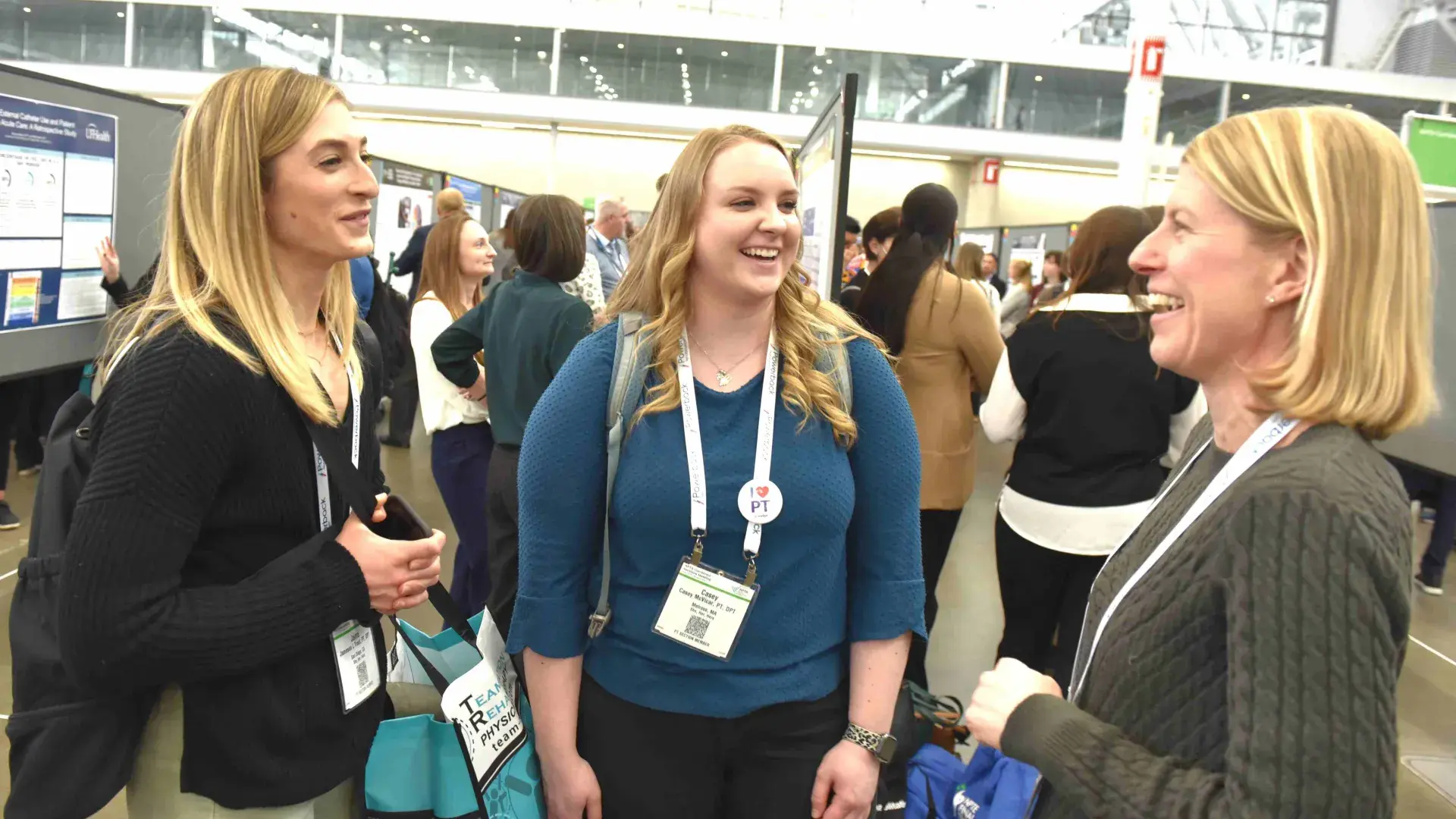 Three women talking and smiling