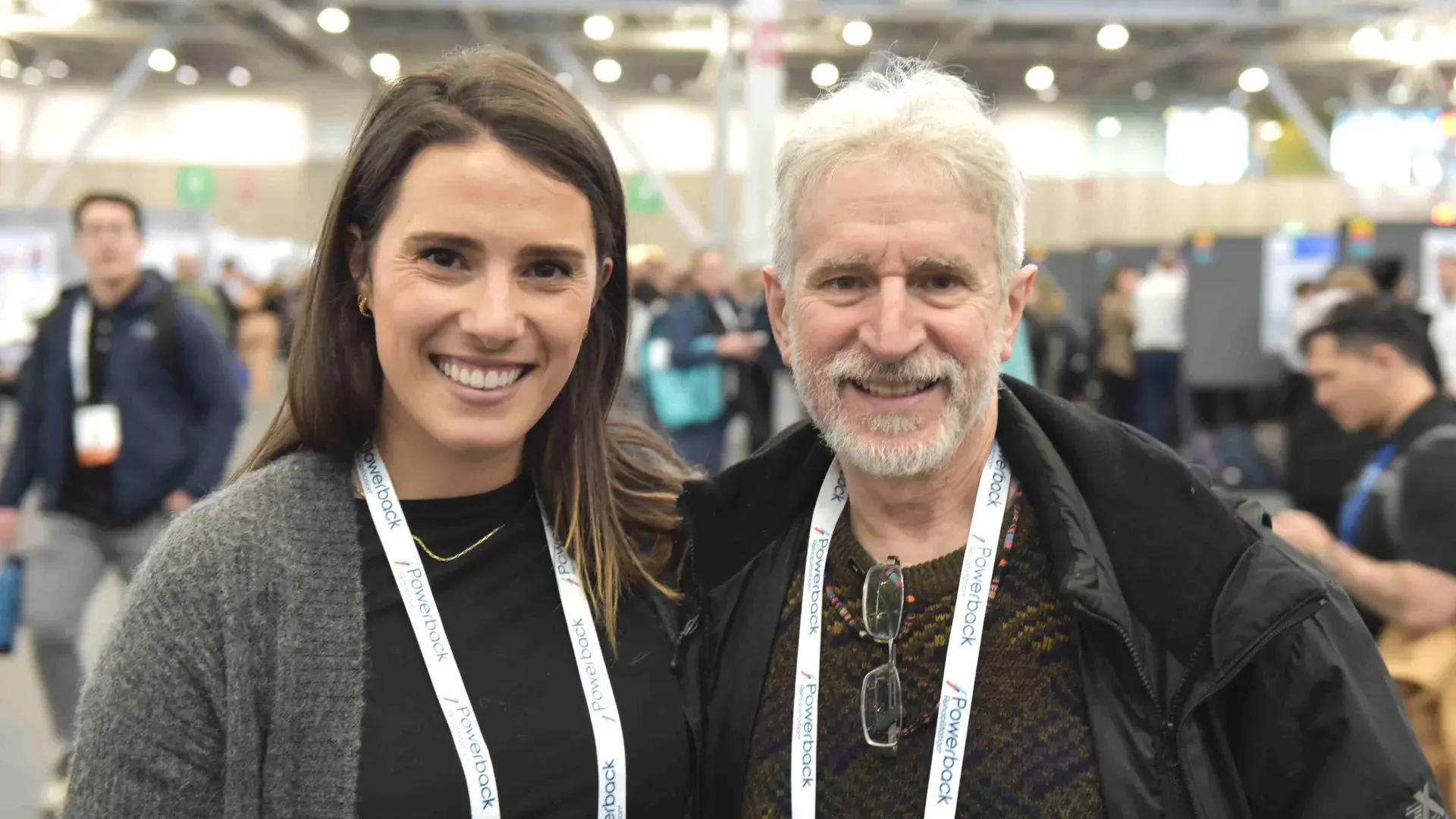 Man and woman pose and smile